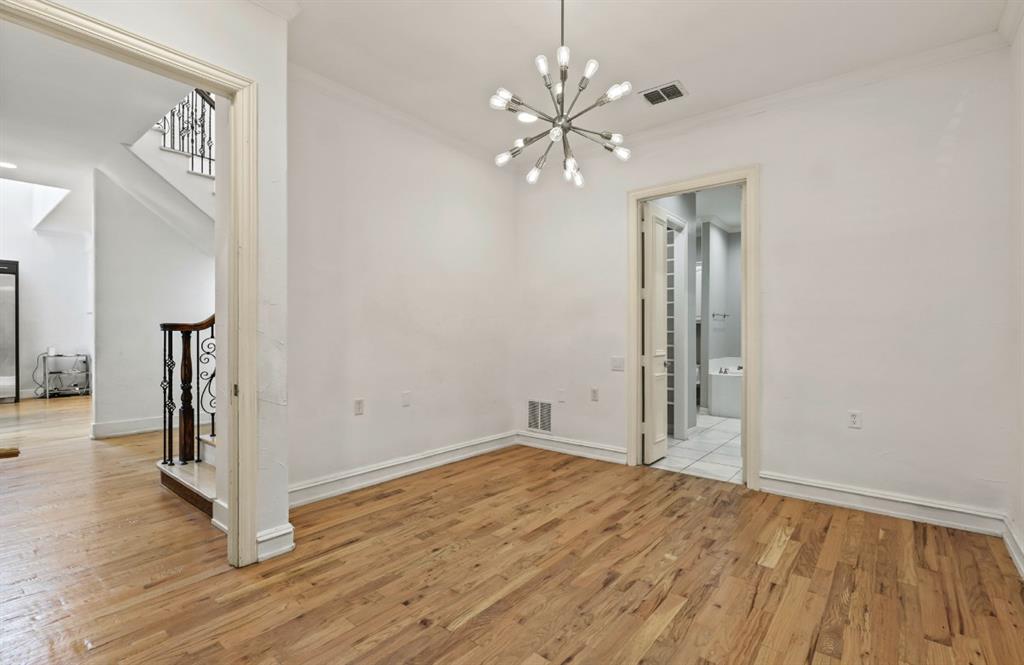 11911 Edgestone Road Dallas, TX 75230 - Photo 17 of 40 wooden floor in an empty room with a window