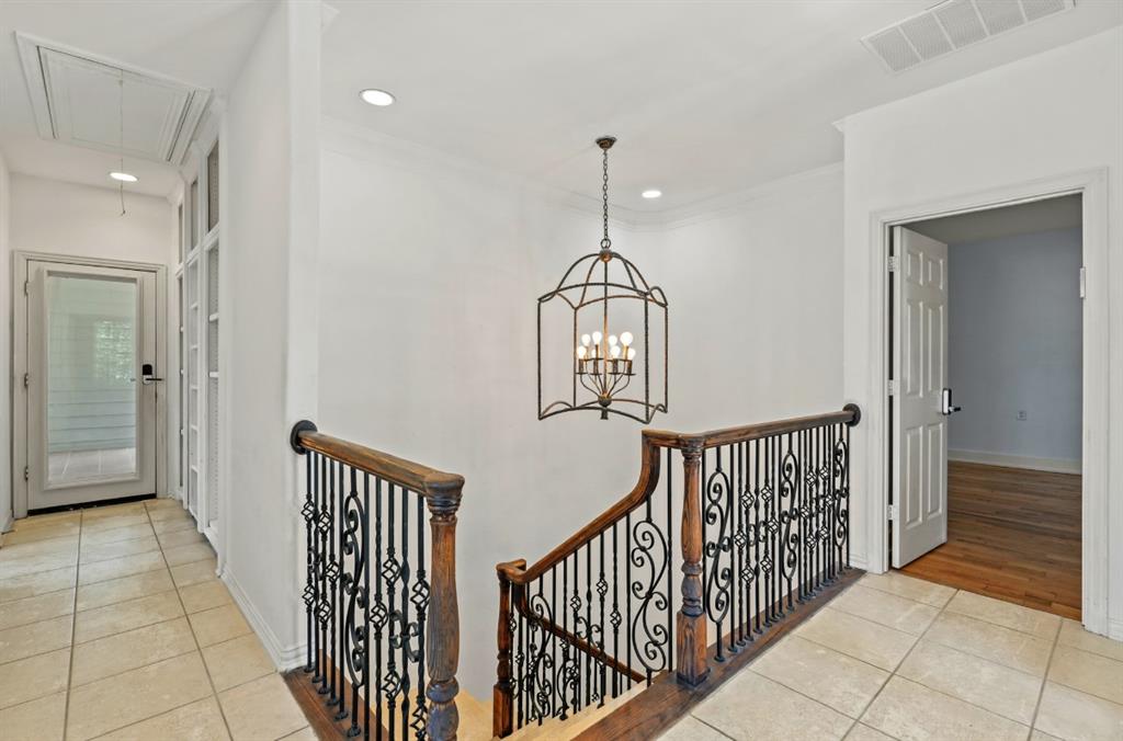 11911 Edgestone Road Dallas, TX 75230 - Photo 19 of 40 a view of a hallway with entryway door