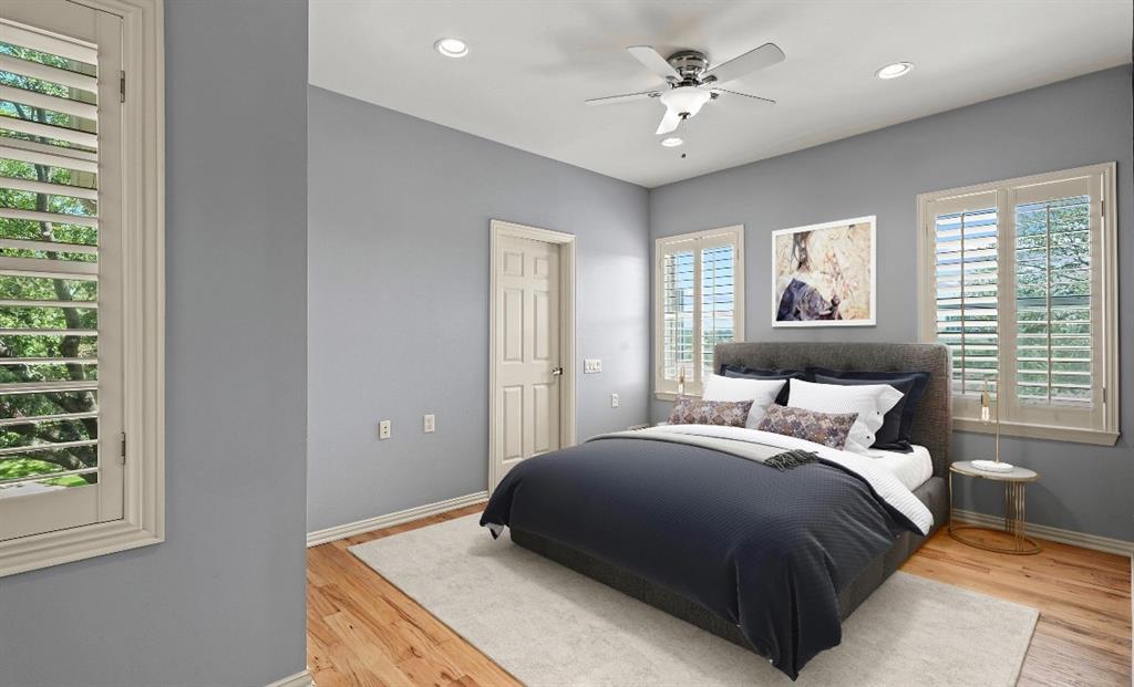 11911 Edgestone Road Dallas, TX 75230 - Photo 25 of 40 a bedroom with a bed and a window