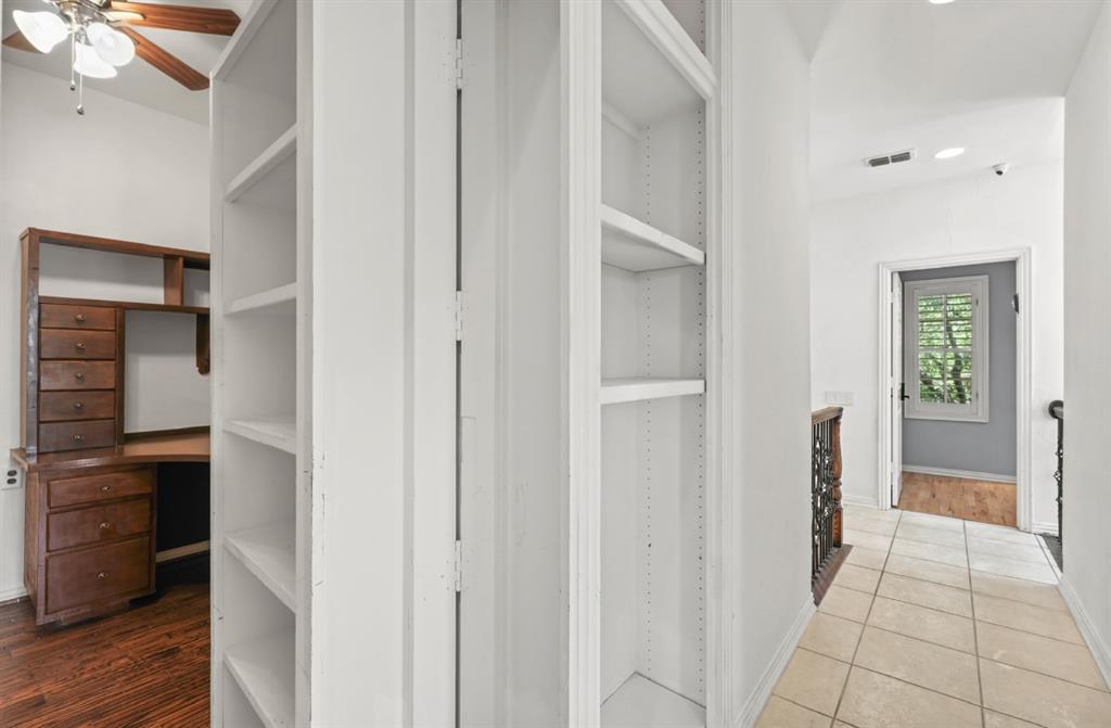 11911 Edgestone Road Dallas, TX 75230 - Photo 32 of 40 Corridor with tile patterned flooring and built in features