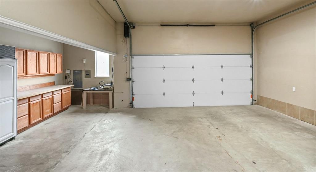 11911 Edgestone Road Dallas, TX 75230 - Photo 36 of 40 Garage featuring electric panel