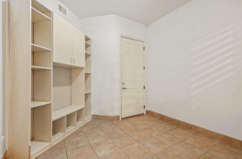 11911 Edgestone Road Dallas, TX 75230 - Photo 38 of 40 Mudroom with baseboards and light tile patterned floors