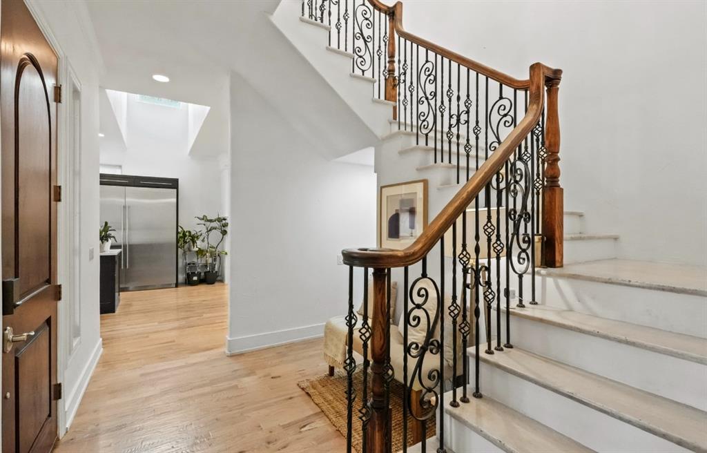 11911 Edgestone Road Dallas, TX 75230 - Photo 4 of 40 a view of entryway and hall with wooden floor