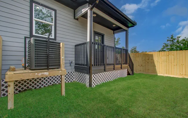 a view of a backyard with a small cabin