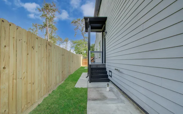 a view of a pathway with a backyard