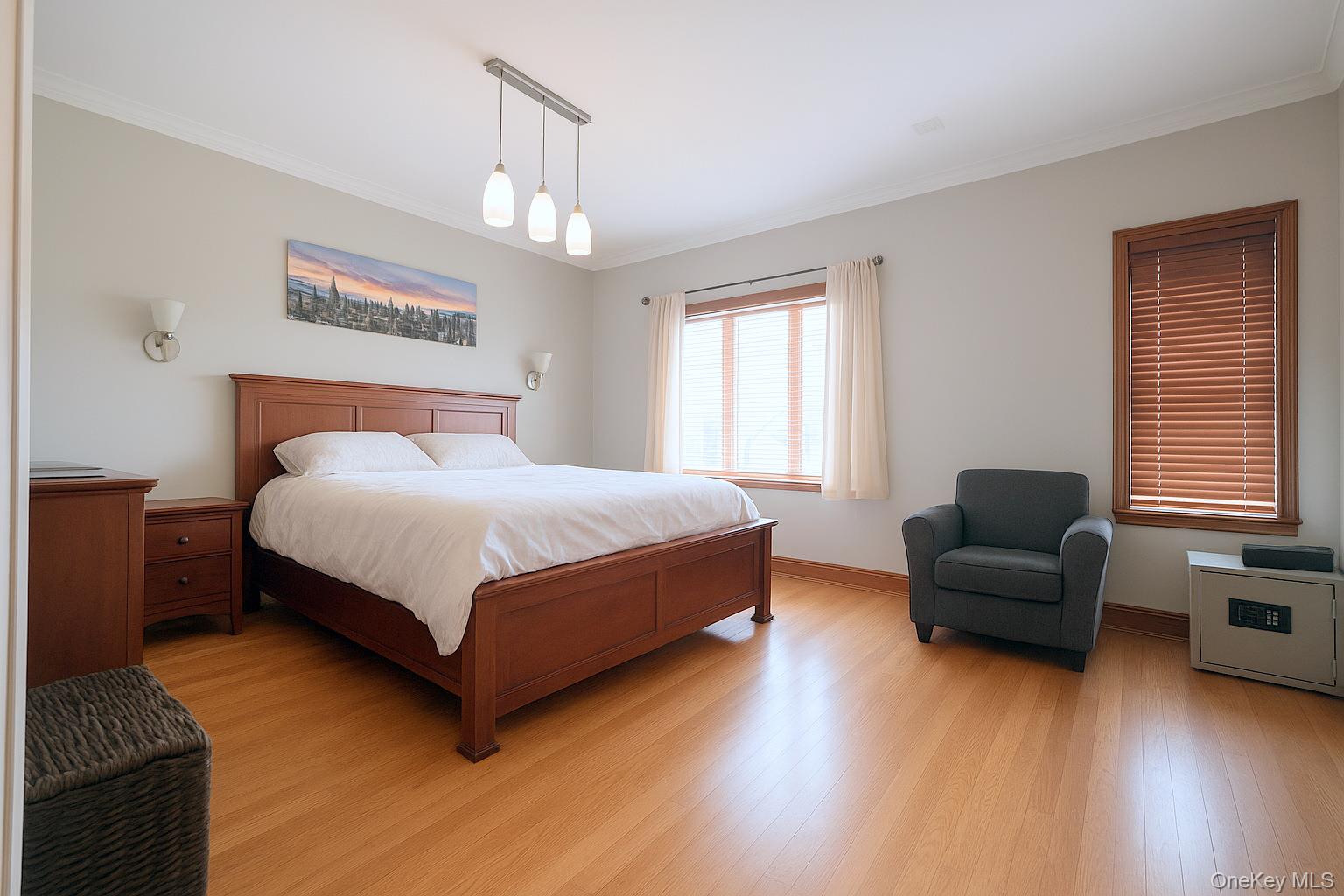 67-31 52nd Road Queens, NY 11378 - Photo 7 of 21 Bedroom featuring wood finished floors and ornamental molding