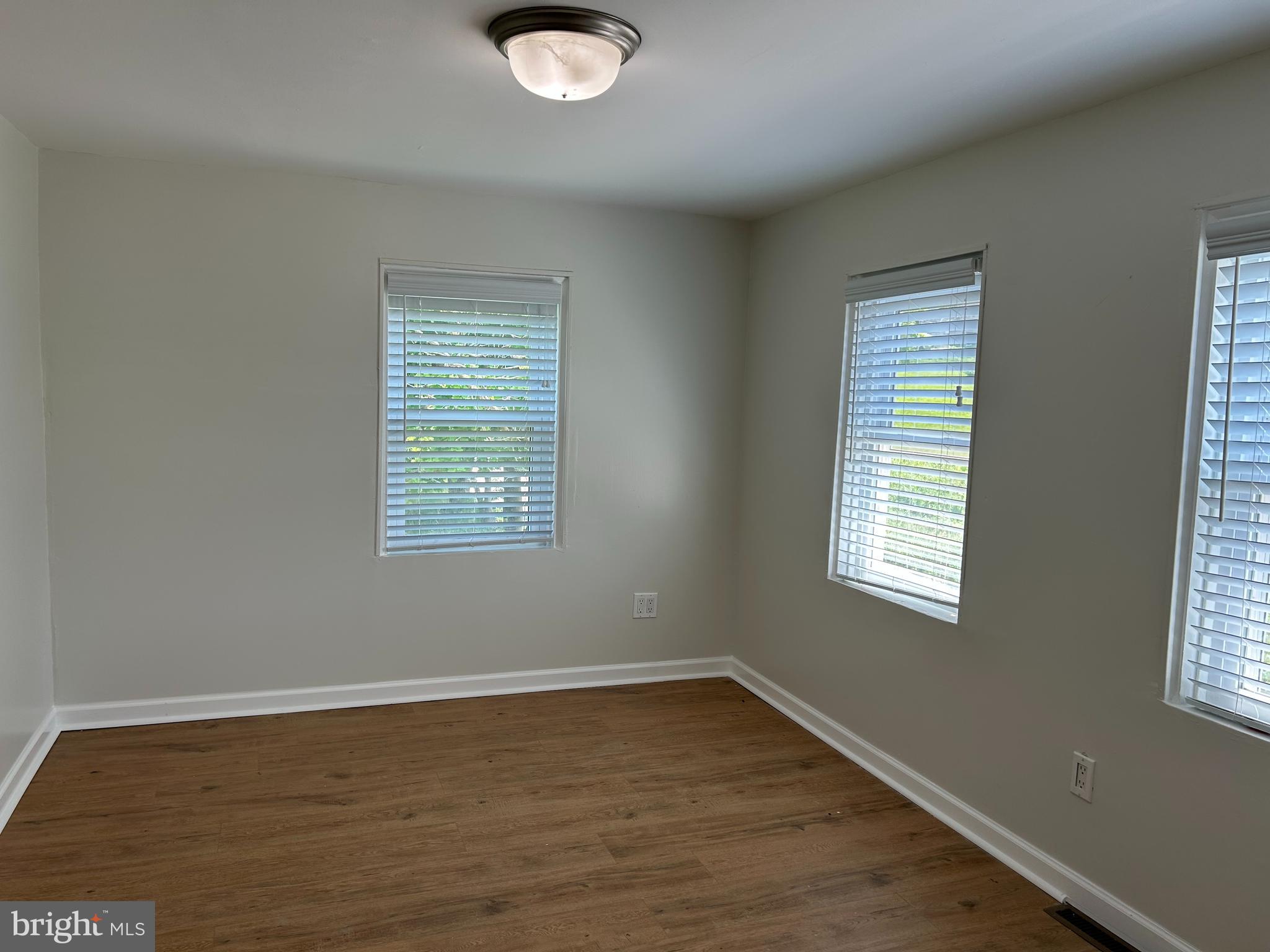 1299 Porters Road Spring Grove, PA 17362 - Photo 14 of 21 a view of an empty room with wooden floor and a window