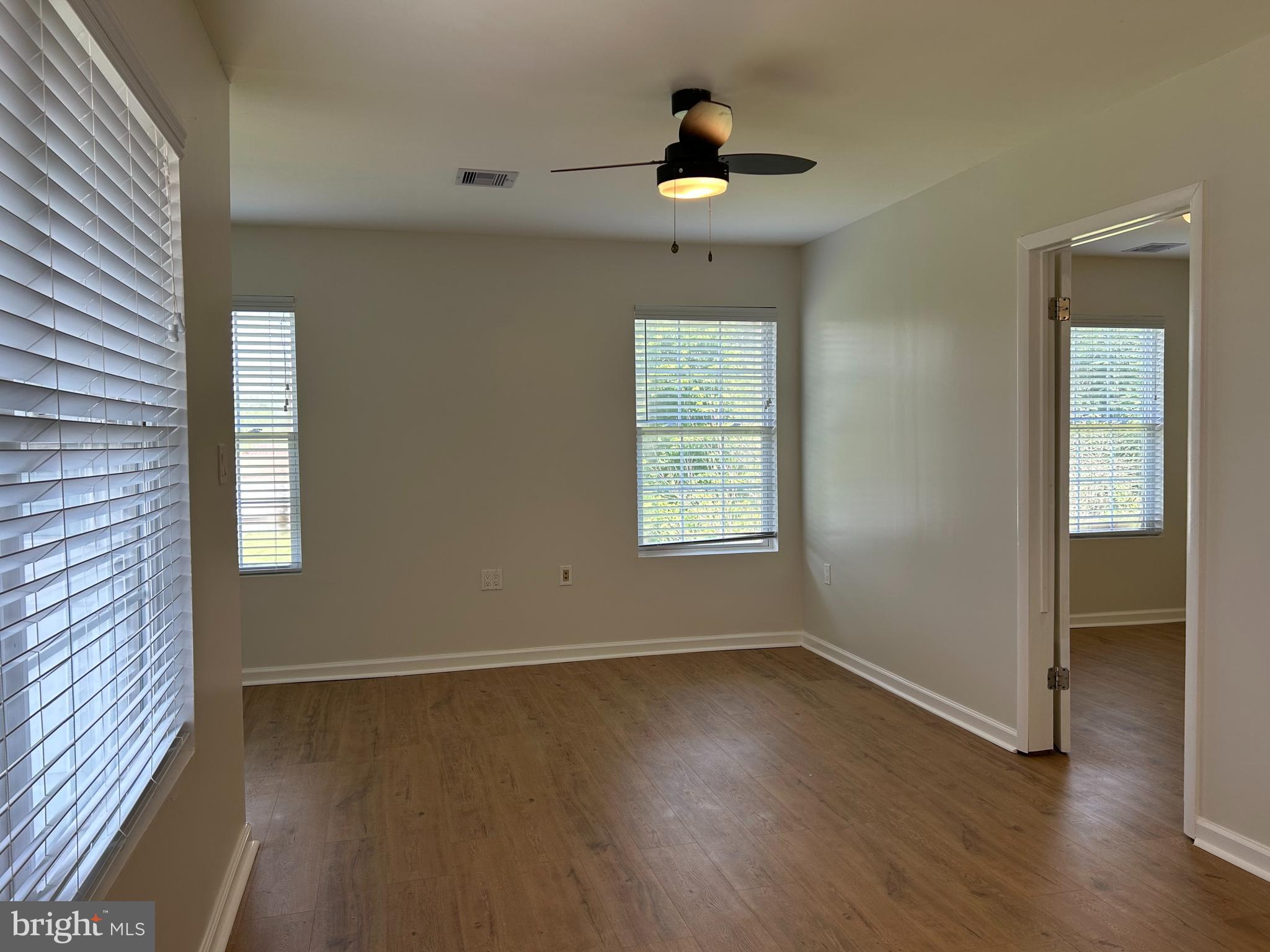 1299 Porters Road Spring Grove, PA 17362 - Photo 18 of 21 an empty room with wooden floor and windows
