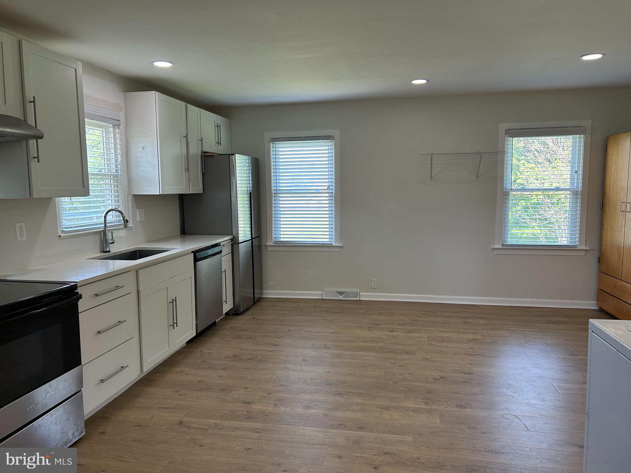 1299 Porters Road Spring Grove, PA 17362 - Photo 3 of 21 a kitchen with granite countertop a sink a window and stainless steel appliances