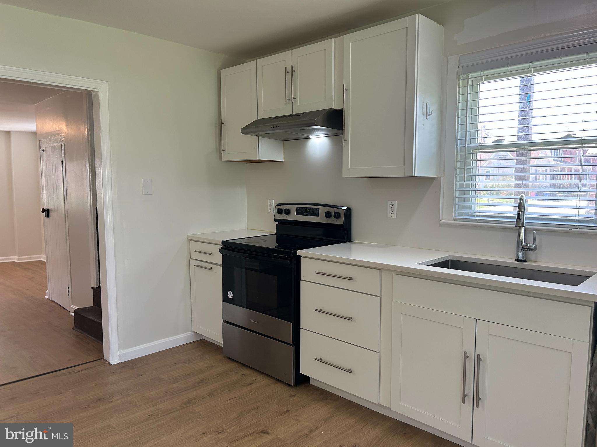 1299 Porters Road Spring Grove, PA 17362 - Photo 4 of 21 a kitchen with white cabinets and a sink