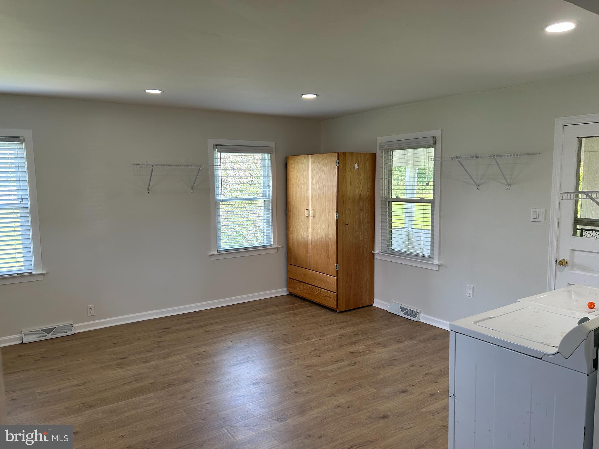 1299 Porters Road Spring Grove, PA 17362 - Photo 7 of 21 an empty room with wooden floor and windows