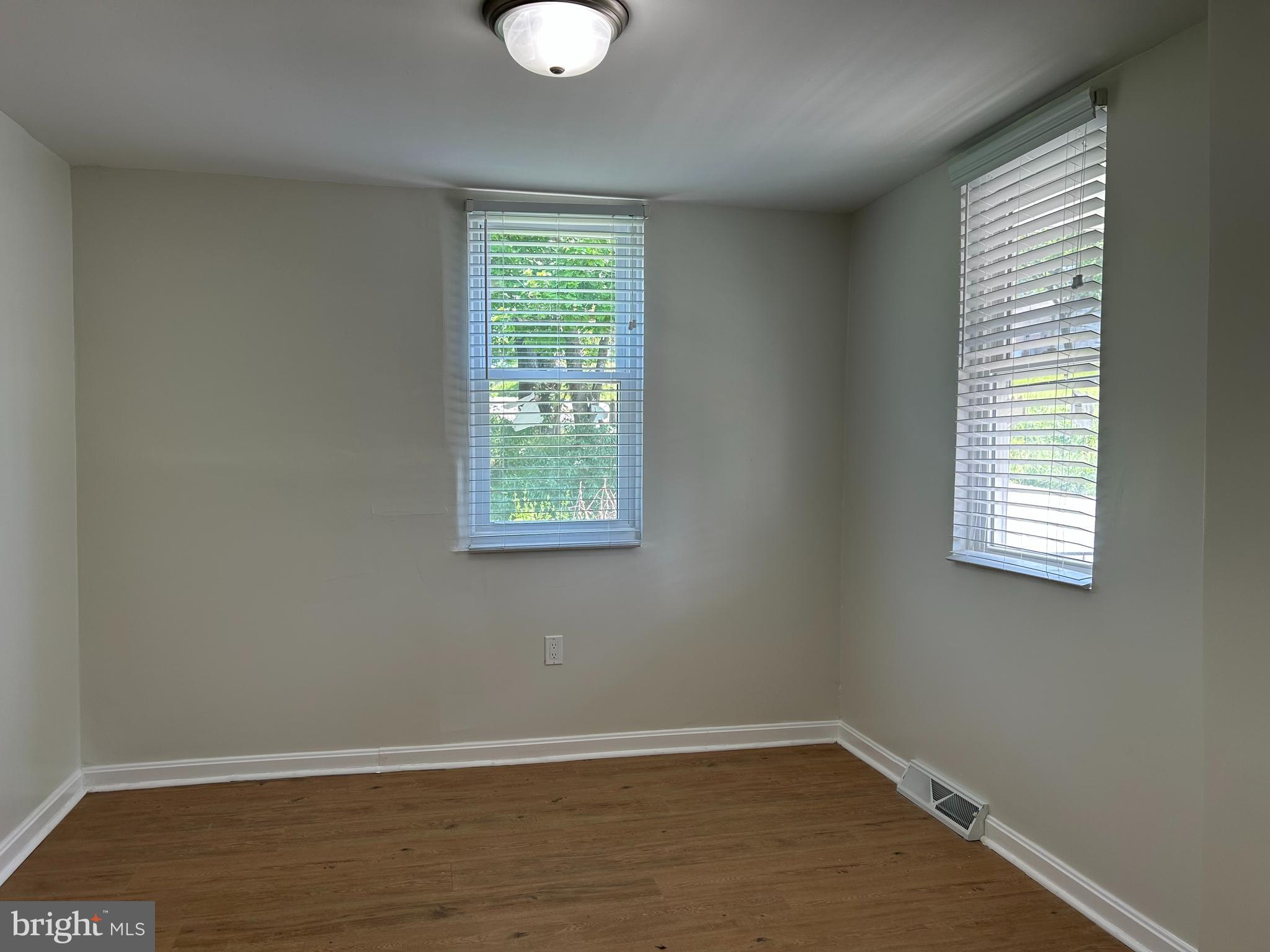 1299 Porters Road Spring Grove, PA 17362 - Photo 9 of 21 an empty room with wooden floor and windows