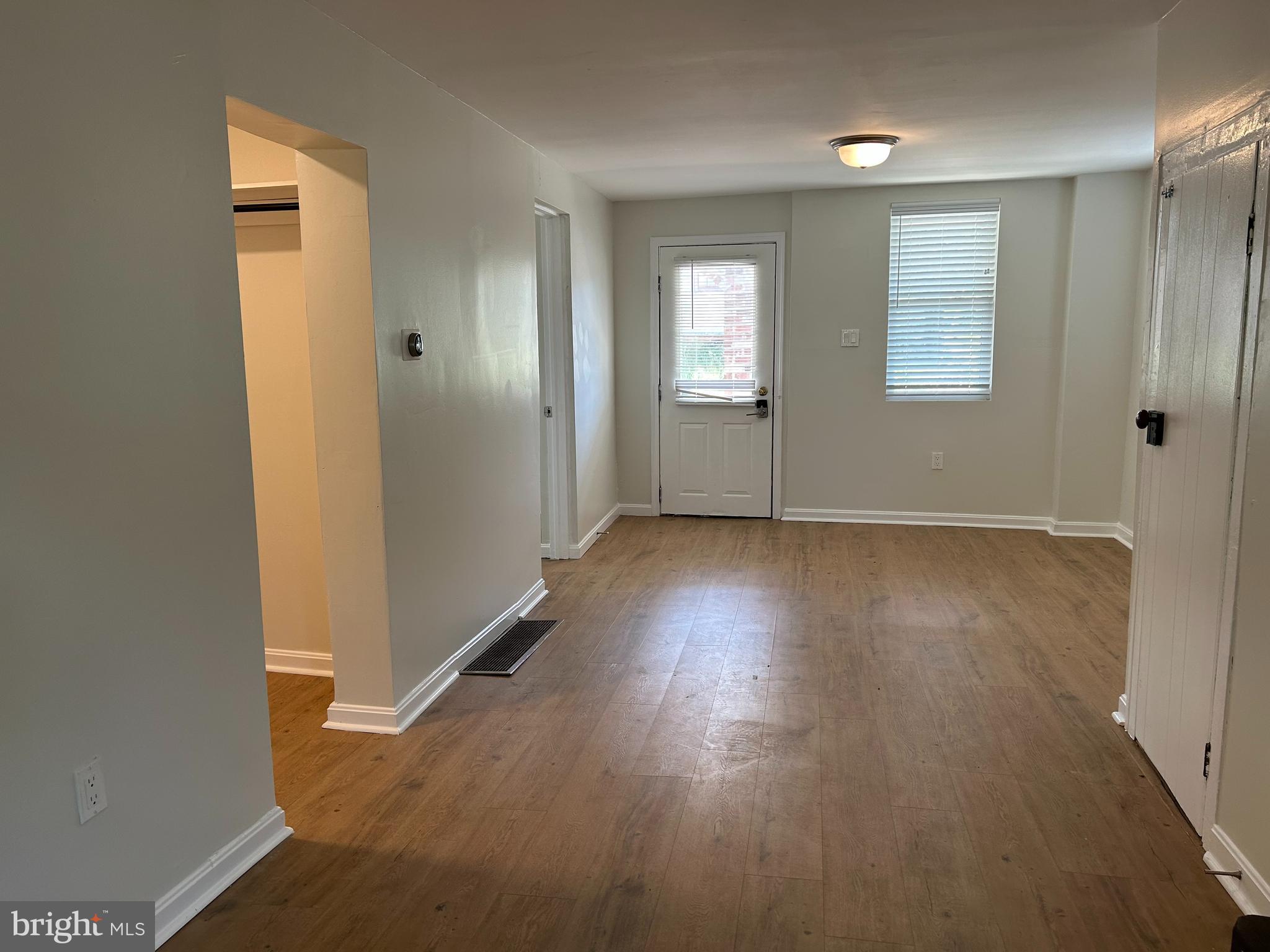 1299 Porters Road Spring Grove, PA 17362 - Photo 10 of 21 an empty room with wooden floor and windows