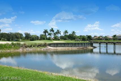 28605 San Lucas Lane, Unit 102 Bonita Springs, FL 34135 - Photo 16 of 20 a view of a lake with houses in the back