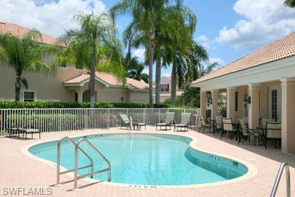 28605 San Lucas Lane, Unit 102 Bonita Springs, FL 34135 - Photo 18 of 20 a view of a swimming pool with a patio