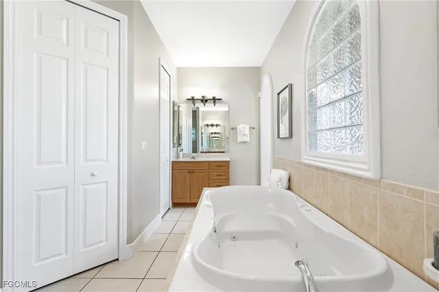 a en suite bathroom with a sink and a bathtub