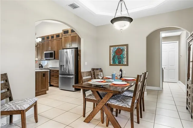 a dining room with furniture and window
