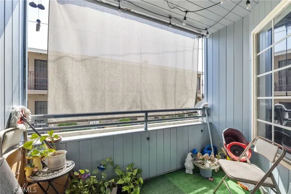 a backyard with table and chairs