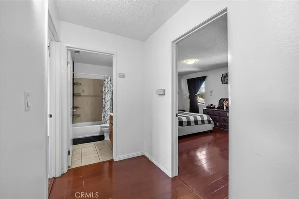 a view of a bedroom from a hallway