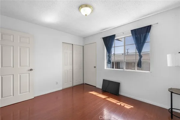 a view of a livingroom with an empty space and a window