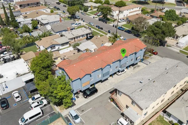 an aerial view of residential houses with outdoor space