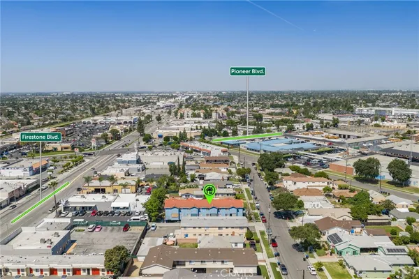 an aerial view of residential houses with outdoor space