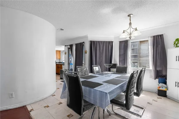 a view of a dining room with furniture and window
