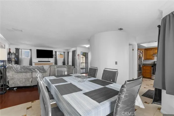 a view of a livingroom with furniture and a flat screen tv