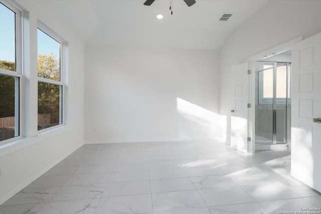 a view of an empty room with a window