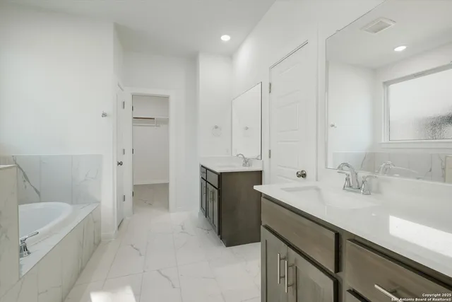 a view of an empty room with windows