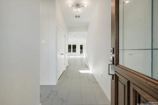 a kitchen with kitchen island a sink stainless steel appliances and cabinets