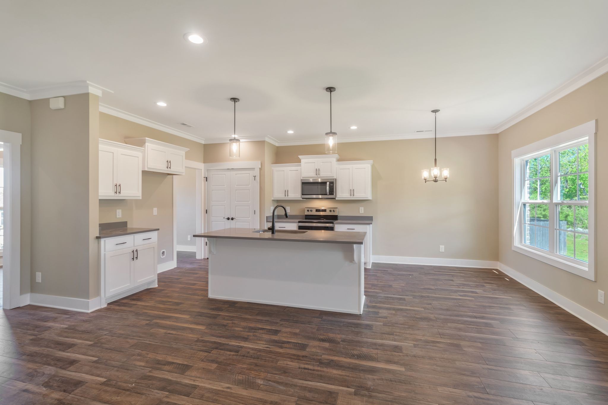 1175 Rimrock Road Smyrna, TN 37167 - Photo 15 of 35 a kitchen with stainless steel appliances kitchen island wooden cabinets and granite counter tops