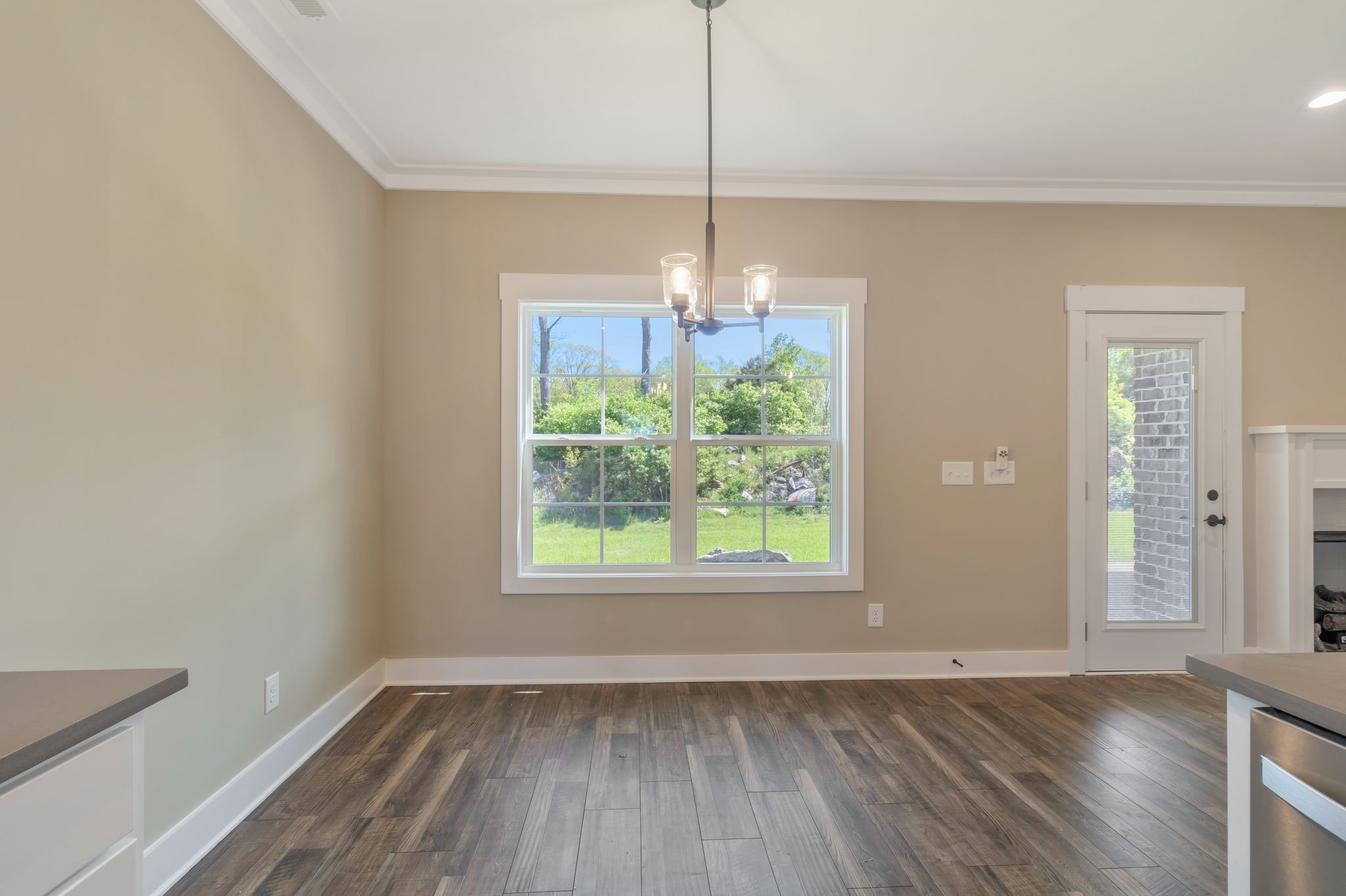 1175 Rimrock Road Smyrna, TN 37167 - Photo 16 of 35 an empty room with wooden floor and windows