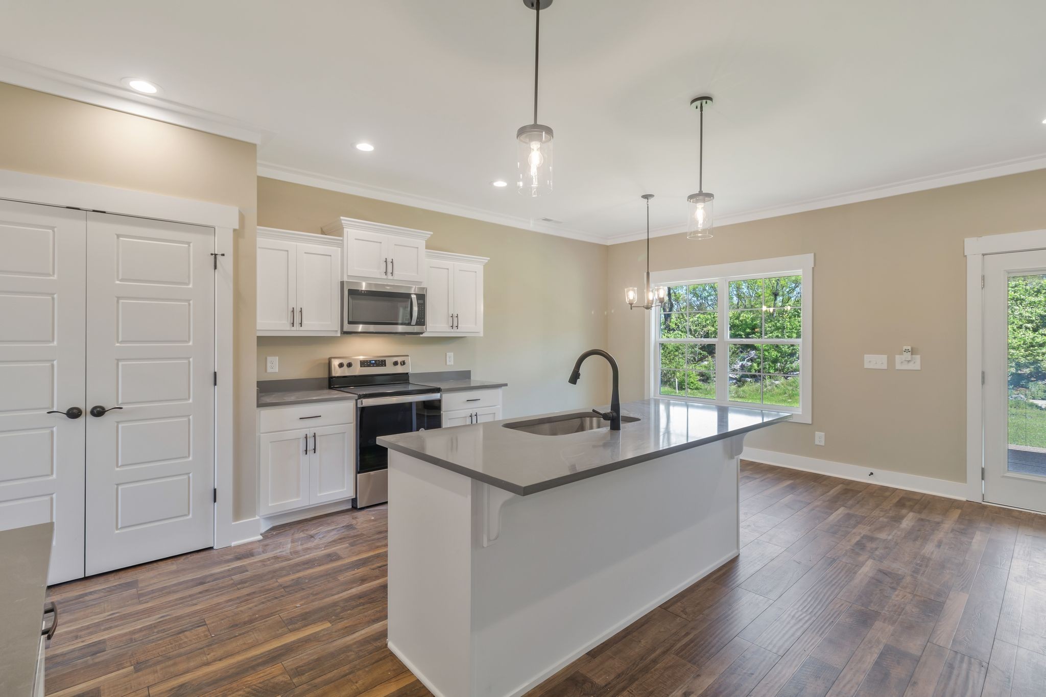 1175 Rimrock Road Smyrna, TN 37167 - Photo 19 of 35 a kitchen with granite countertop a sink appliances wooden floor and a window