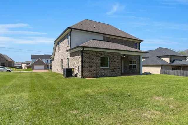 a view of a house with a big yard