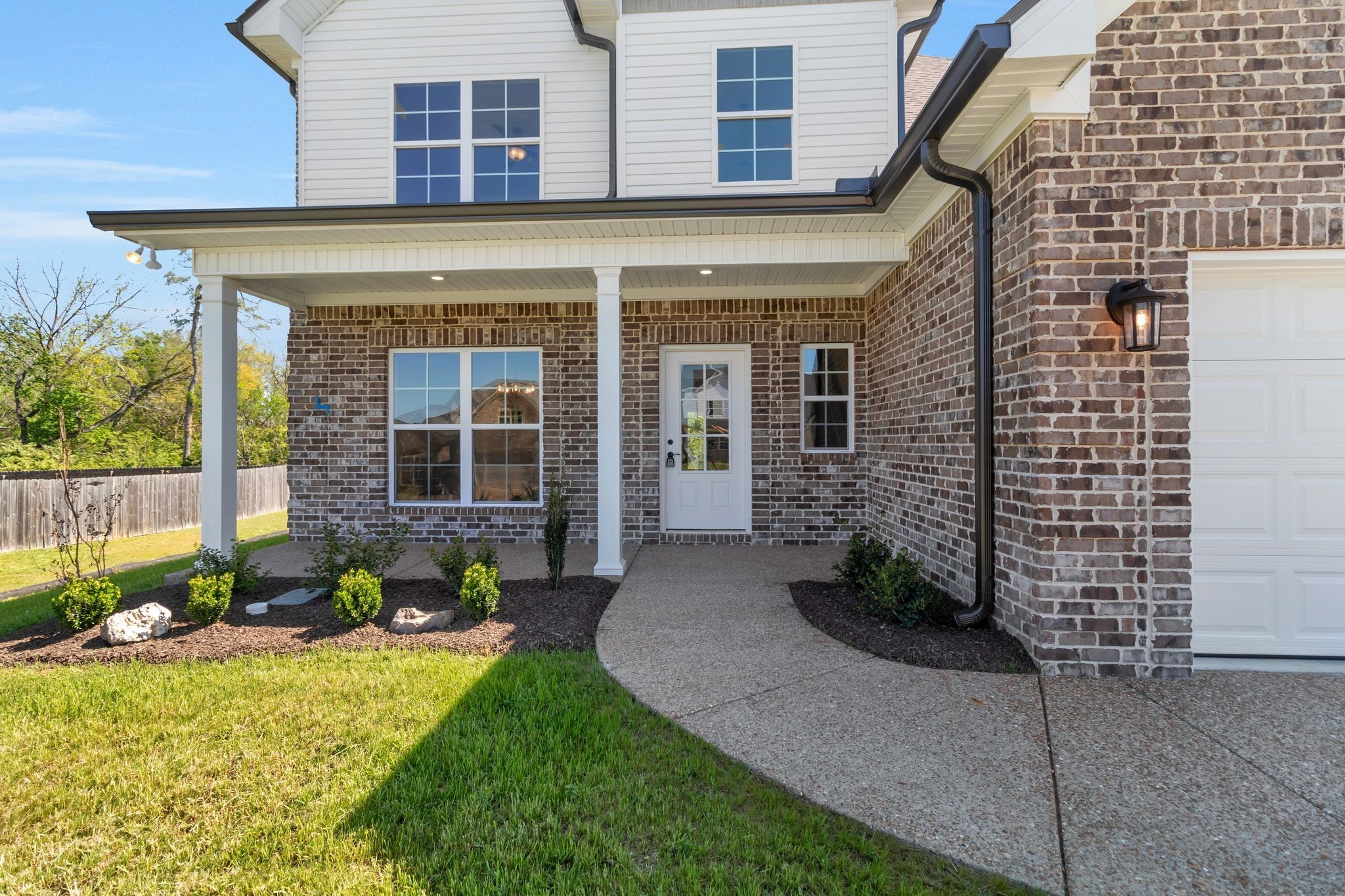 1175 Rimrock Road Smyrna, TN 37167 - Photo 5 of 35 a front view of a house with garden