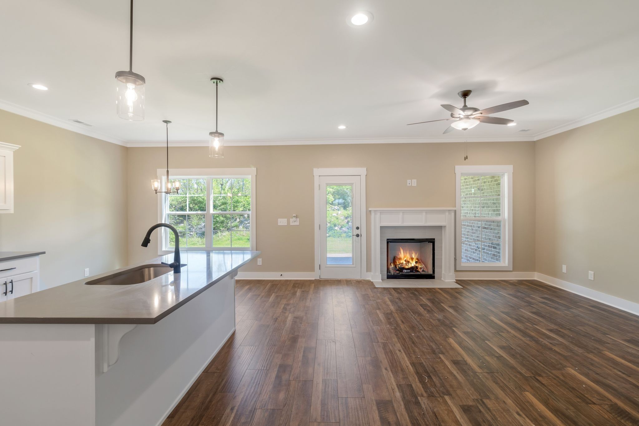 1175 Rimrock Road Smyrna, TN 37167 - Photo 10 of 35 a view of a kitchen with furniture a fireplace and wooden floor