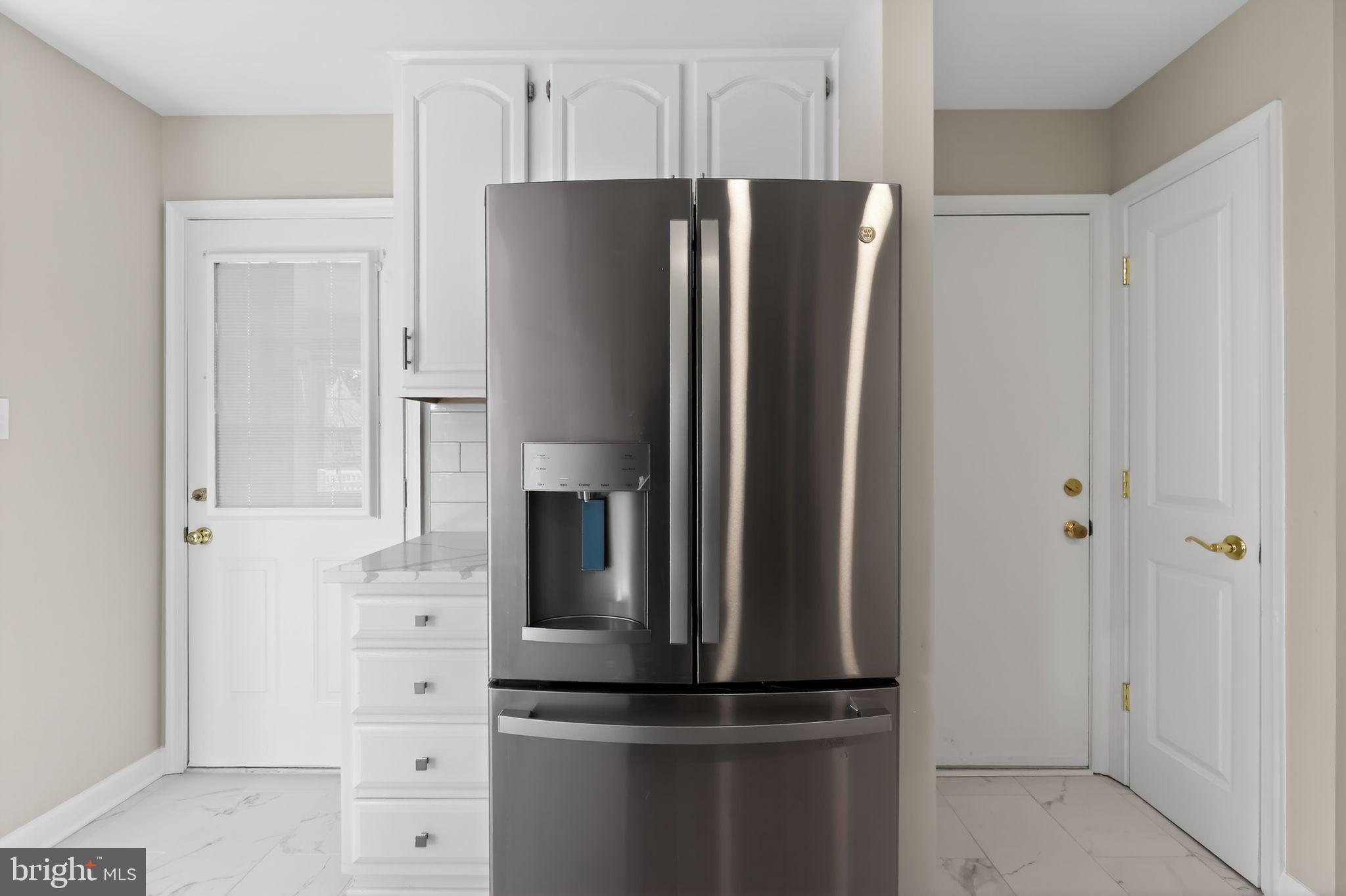 825 Dunbrooke Court Frederick, MD 21701 - Photo 15 of 31 a metallic refrigerator freezer sitting in a kitchen