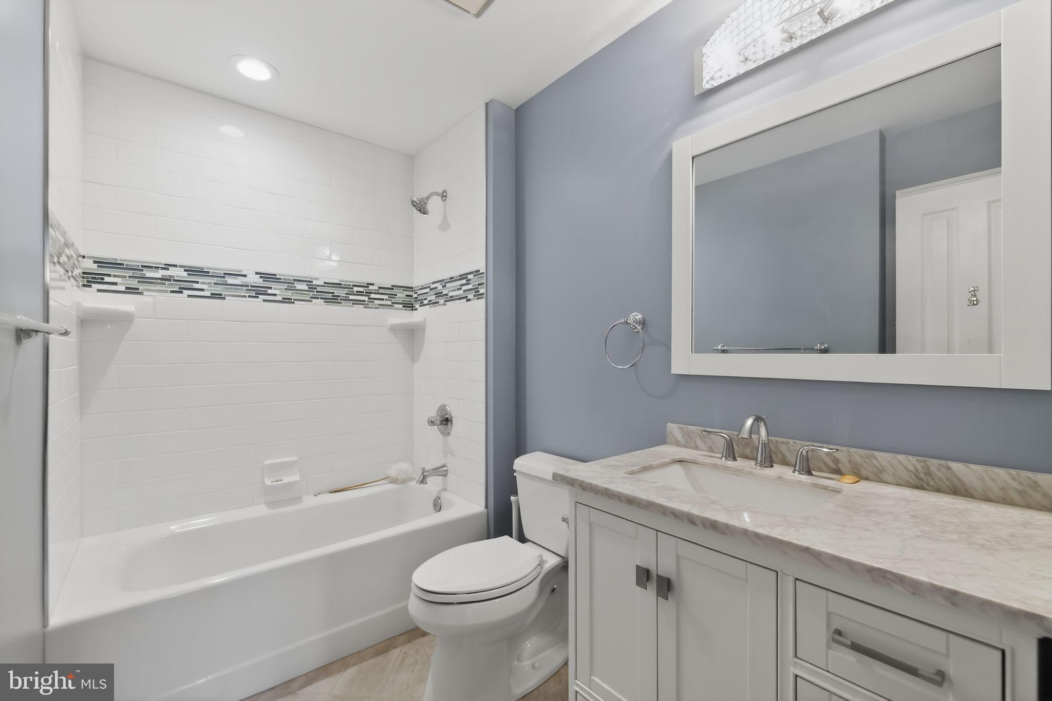825 Dunbrooke Court Frederick, MD 21701 - Photo 19 of 31 a bathroom with a granite countertop sink toilet and shower