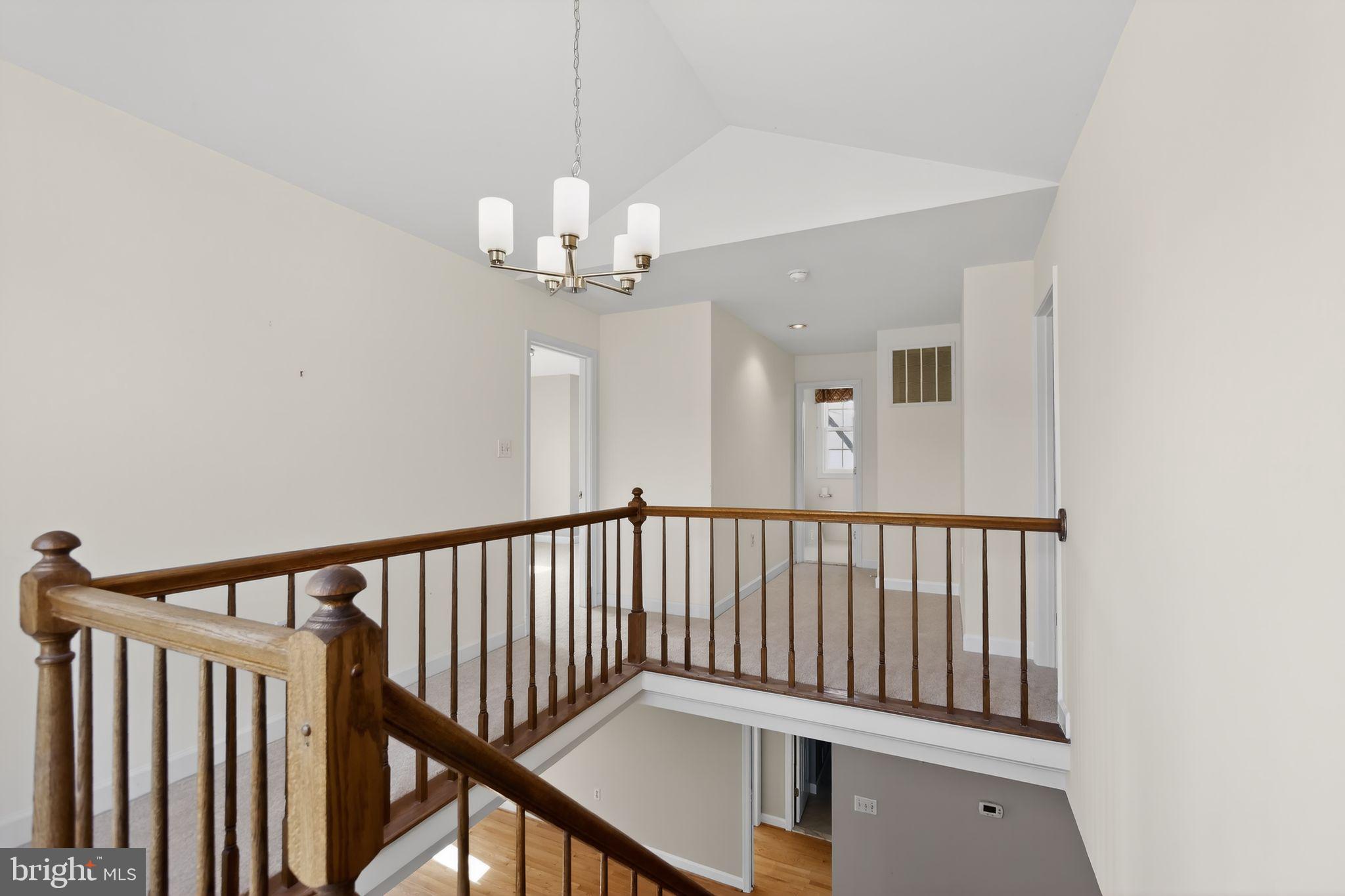 825 Dunbrooke Court Frederick, MD 21701 - Photo 21 of 31 a view of a hallway with a chandelier