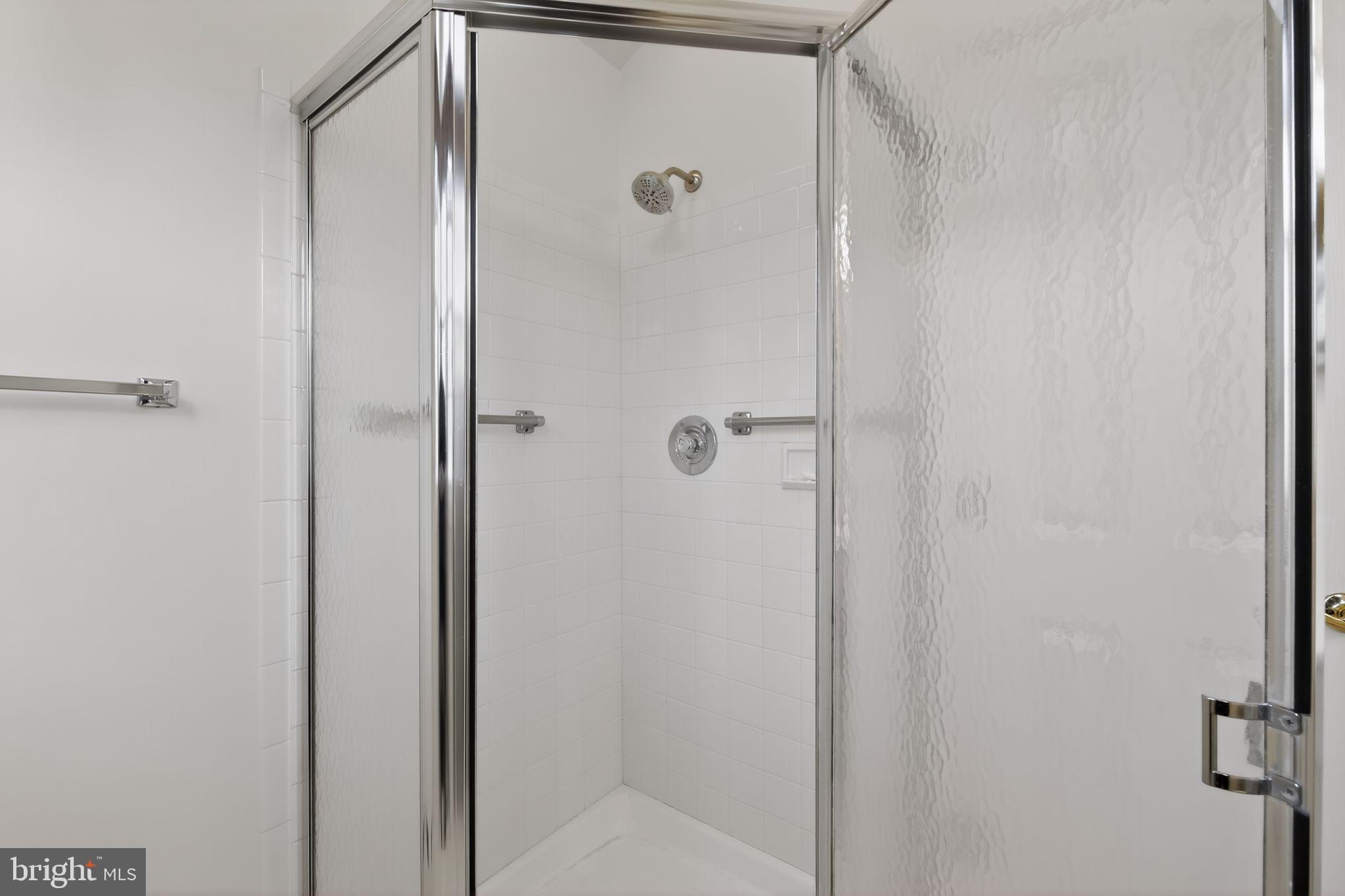 825 Dunbrooke Court Frederick, MD 21701 - Photo 26 of 31 a bathroom with a glass shower door