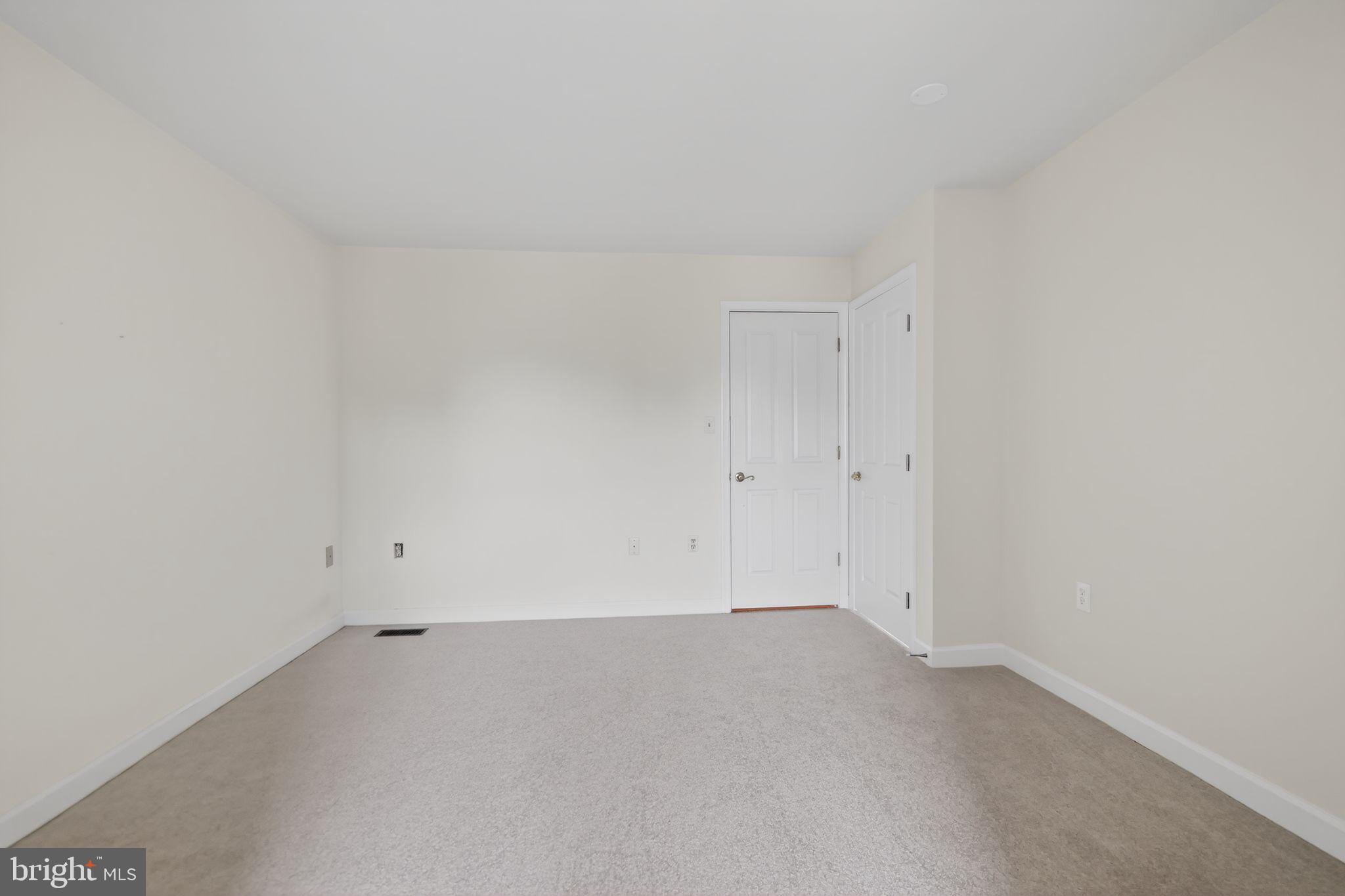 825 Dunbrooke Court Frederick, MD 21701 - Photo 27 of 31 an empty room with an entryway