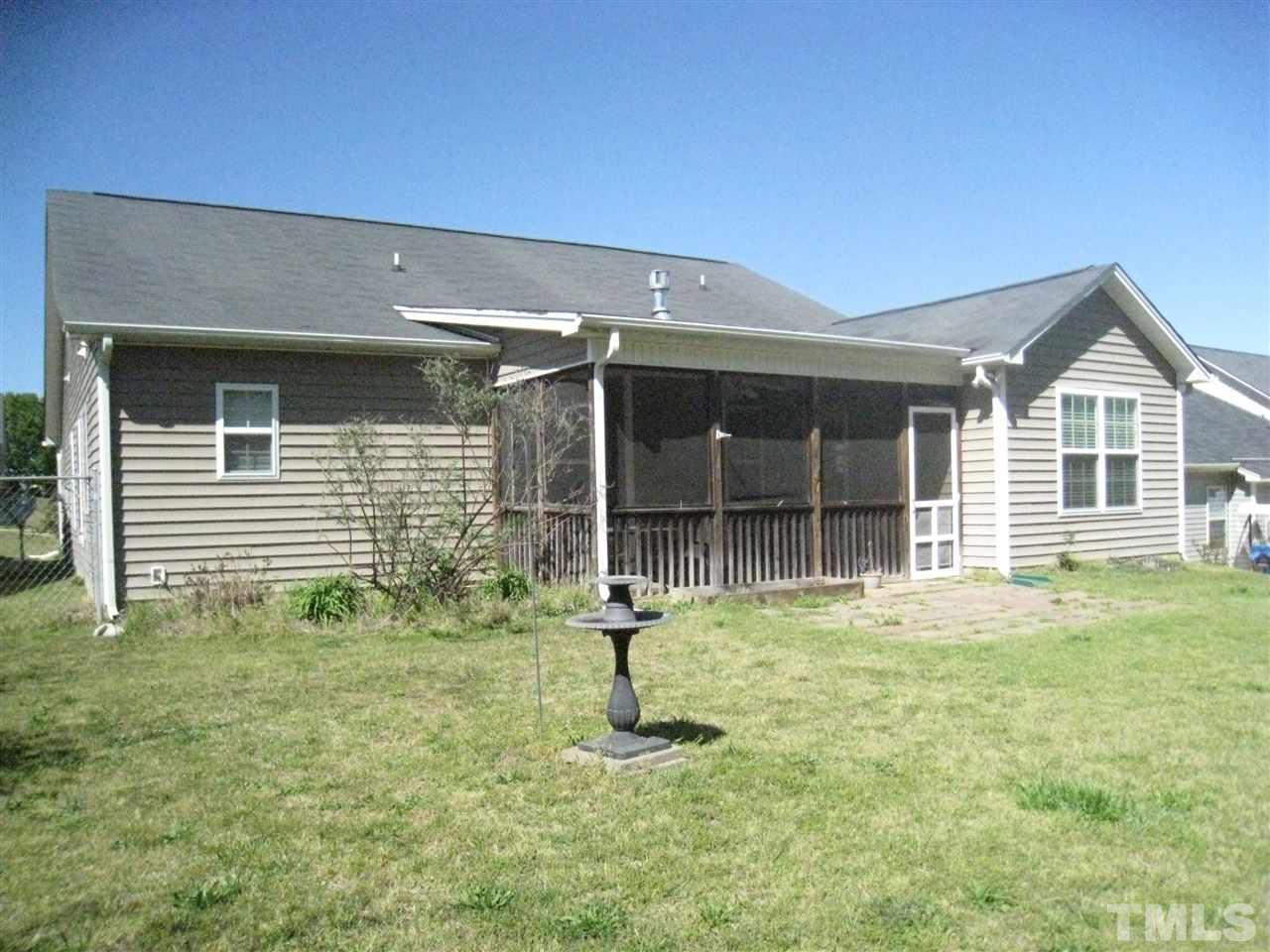 60 Brax Carr Way Angier, NC 27501 - Photo 2 of 14 a house view with a garden space
