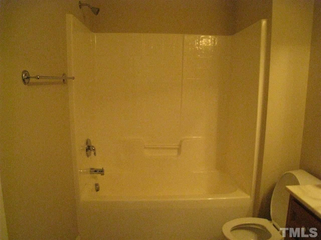 60 Brax Carr Way Angier, NC 27501 - Photo 12 of 14 a bathroom with a shower