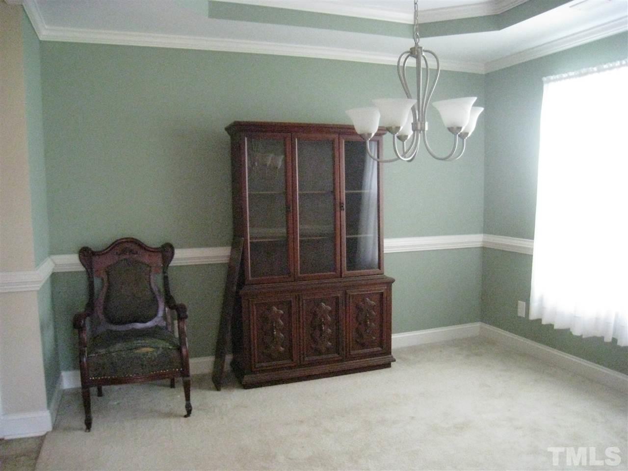 60 Brax Carr Way Angier, NC 27501 - Photo 9 of 14 a view of a room that has a window and chair