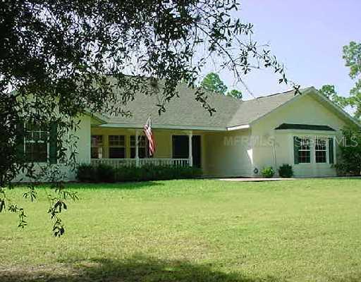 Exterior Front - North Port Best Buy!! 4/3/2 HEated Pool/Spa Home On 2 1/2 Acres Almost 2500 u/Air, Eat-In Kithcen, Solid Surface Counters, Wood Cabinets, Spacious Floor Plan, Crown Molding & Much More! Entire Property Is Fenced w/Gated Circular Driveway!