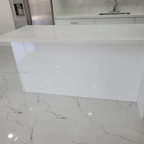 an empty room with wooden floor