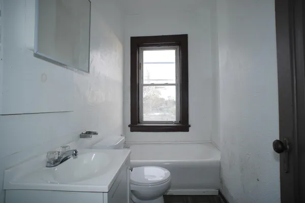 a bathroom with a sink toilet and bathtub
