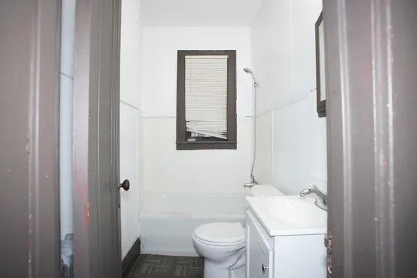 a bathroom with a toilet and a sink