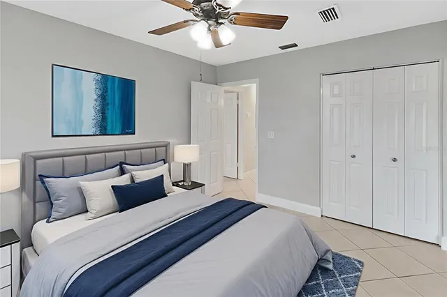 a bedroom with bed and window